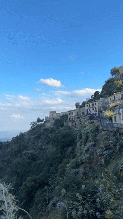Church service documented in Mediterranean hillside village, Italy