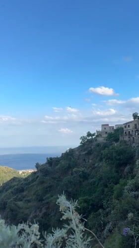 Church service documented in Mediterranean hillside village, Italy