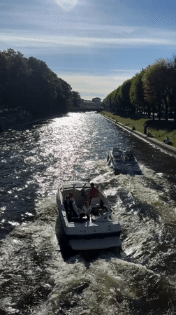 Busy summer afternoon on Saint Petersburg's canals and city streets