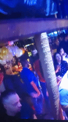 Nightclub event with dancing crowd captured in Mława, Poland