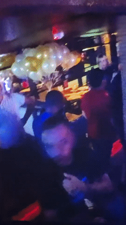 Nightclub event with dancing crowd captured in Mława, Poland