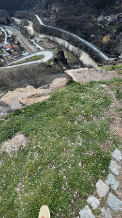 Visitor explores elevated viewpoint overlooking valley in Bov, Bulgaria