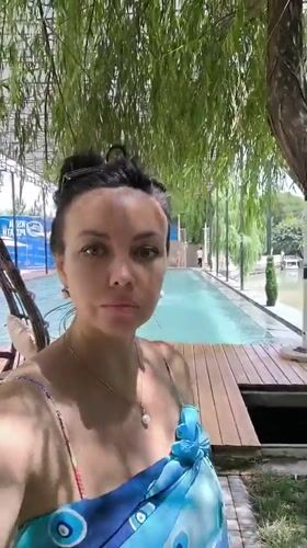 Poolside selfies at a Tajikistan resort, July 2026