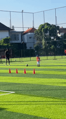 Soccer training session with coach and child in Denpasar