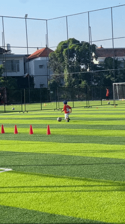 Soccer training session with coach and child in Denpasar