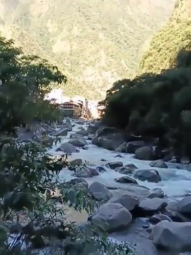 Tourist captures selfie moment at Machupicchu river bridge