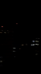 Nighttime London cityscape captured in motion-blurred video footage