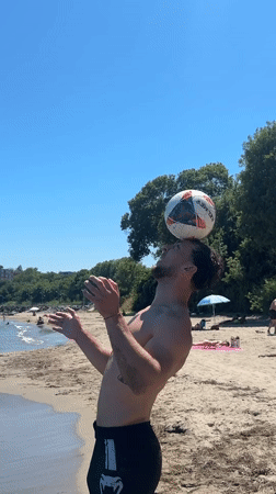 Man performs soccer tricks on Tsarevo beach morning