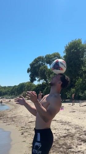 Man performs soccer tricks on Tsarevo beach morning