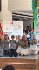 Children perform coordinated dance in Montenegro community hall