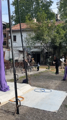 Outdoor event setup observed in Milan with purple draping