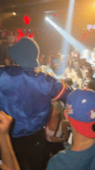 Person in blue jacket performs at Paris venue