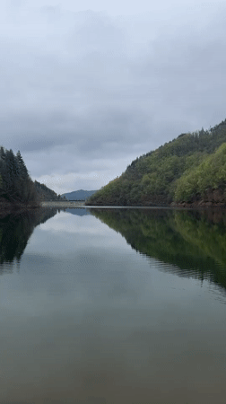 Young man documents scenic lake visit in Alamovtsi, Bulgaria