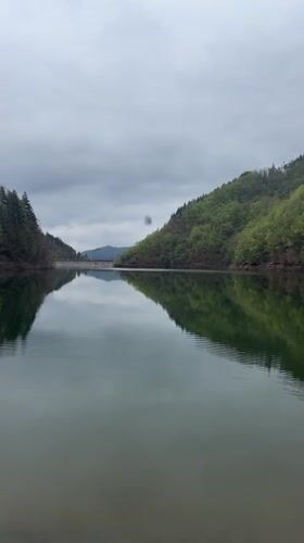 Young man documents scenic lake visit in Alamovtsi, Bulgaria