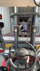 Forklift operations inside shipping container captured in Asenovgrad