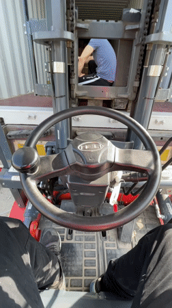 Forklift operations inside shipping container captured in Asenovgrad