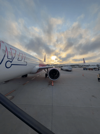 Wizz Air plane on Warsaw tarmac at dusk