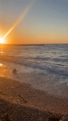 Sunset observed at Sevastopol beach with golden light, gentle waves