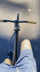 Cyclist rides through sunny Buenos Aires streets
