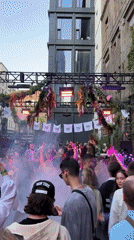 Moscow courtyard hosts afternoon dance party with 'DON'T PANIC' banners