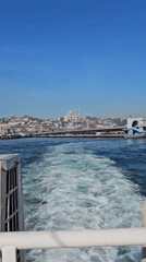 Morning boat departure captures Istanbul skyline from water