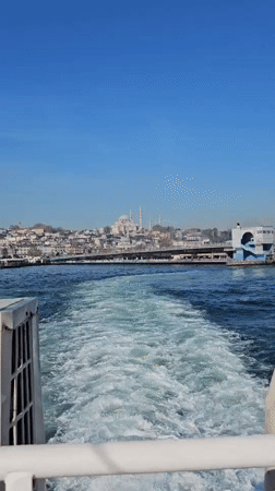 Morning boat departure captures Istanbul skyline from water