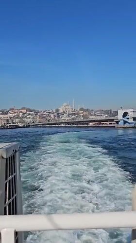 Morning boat departure captures Istanbul skyline from water