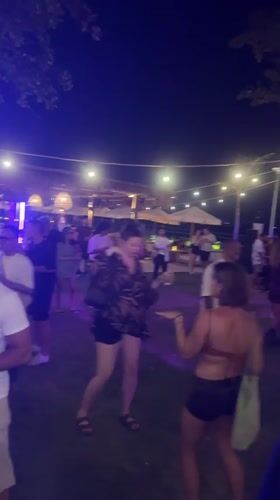 Nighttime outdoor party in Kuta with DJs and fire dancing