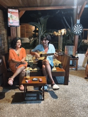 Musician performs acoustic set at Indonesian bar venue