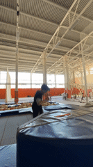 Trampoline somersault results in tumble with cylindrical pad