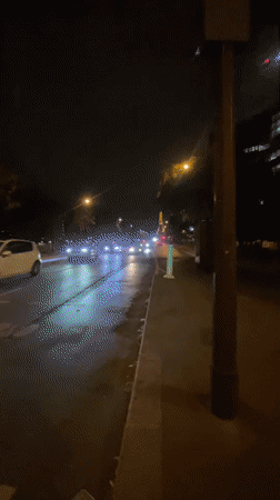 Eiffel Tower lit up on a rainy Paris night