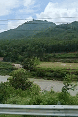 Muddy river and terraced valley at Adamghat, Nepal