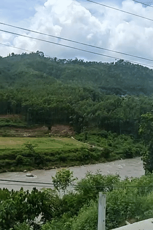 Muddy river and terraced valley at Adamghat, Nepal