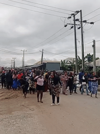 Street procession with dancing and traditional dress in Egbokodo Itsekiri