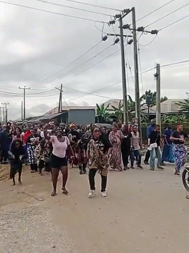 Street procession with dancing and traditional dress in Egbokodo Itsekiri