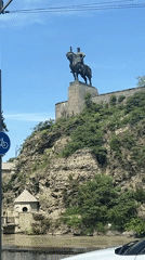 Tourist documents Tbilisi's historic landmarks during morning visit