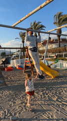 Family enjoys beach playground time in Fethiye, Turkey