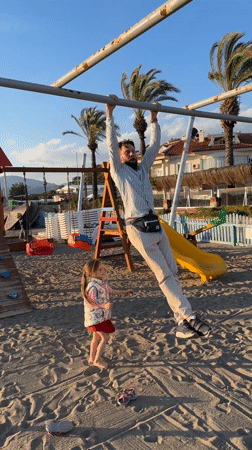 Family enjoys beach playground time in Fethiye, Turkey