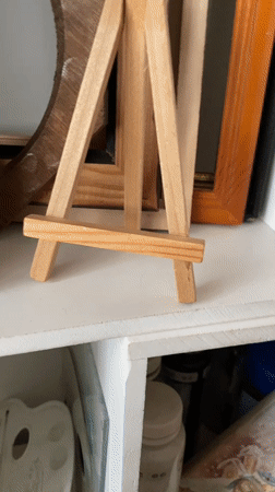 Miniature paintings and a very curious cat in a Bílina home studio