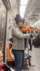 Live violin performance on the Santiago Metro
