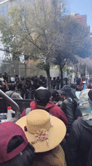 Large crowd gathers on La Paz streets, riot police present