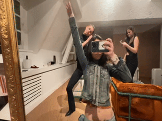 Young Women Document Social Evening at Paris Restaurant-Bookshop