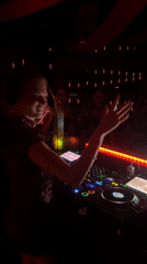 Inside a quirky Bali nightclub with neon signs and a DJ