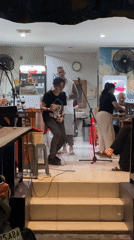 Evening street life and live music captured in Kuta