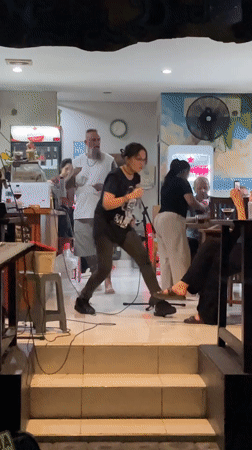 Evening street life and live music captured in Kuta