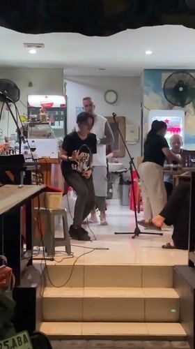 Evening street life and live music captured in Kuta