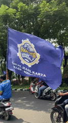Mixed vehicle procession travels through Surabaya streets