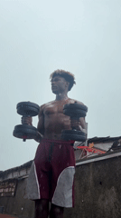 Man exercises outdoors in rain in Igboefon, Nigeria
