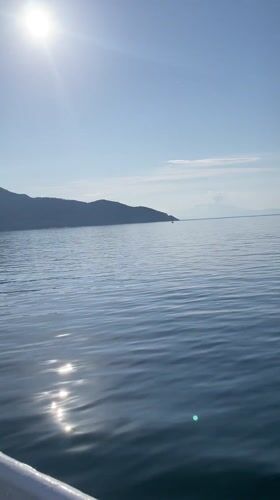 Boat navigates calm waters off Thassos, Greece