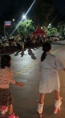 Evening family recreation at Sidoarjo public square features roller skating
